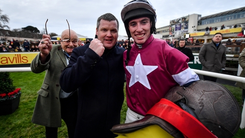 Jack Kennedy (R) celebrates with trainer Gordon Elliott (C) after riding Delta Work to win the Savills Chase