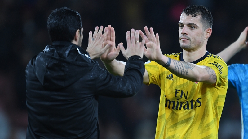 Arsenal head coach Mikel Arteta hugs Granit Xhaka after the Premier League match between AFC Bournemouth and Arsenal FC