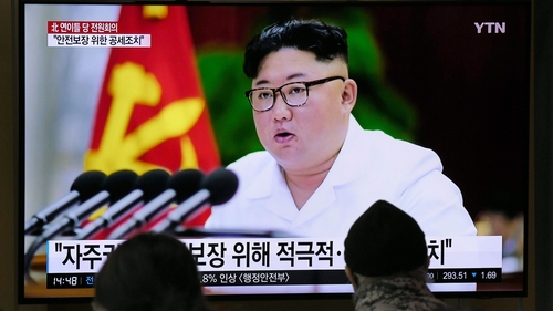 People watch of North Korean leader Kim Jong-un, at a railway station in South Korea