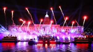 An orchestra plays in front of the Custom House in Dublin's city centre during the Liffey Lights Moment