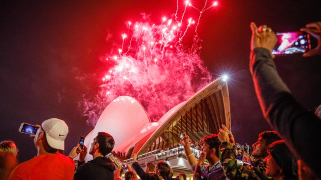 People film the fireworks over Sydney Harbour