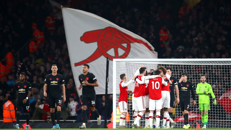 Arsenal players celebrate Sokratis Papastathopoulos's goal at the Emirates