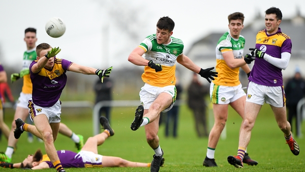 Jason Dempsey of Offaly in action against Tom Byrne of Wexford