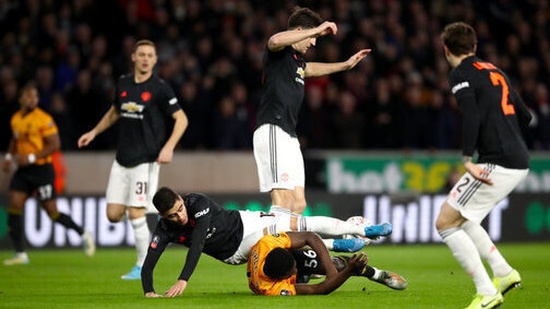 Wolves' Benny Ashley-Seal challenges Andreas Pereira at Molineux