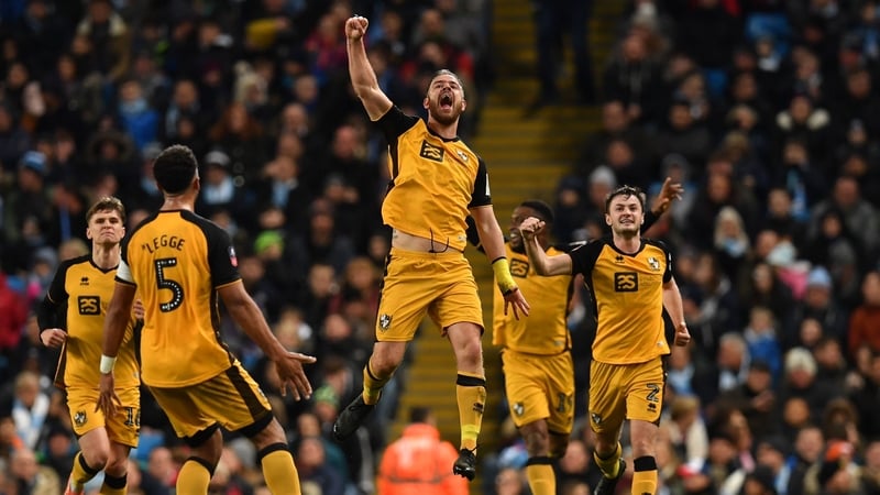 Tom Pope celebrates his goal