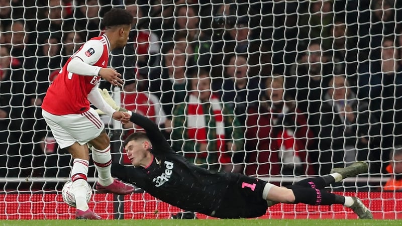 Reiss Nelson slides home the winning goal for Arsenal