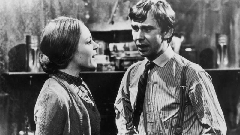 Christopher Beeny as footman Edward Barnes and Jacqueline Tong as his housemaid wife Daisy, in a scene from the period drama Upstairs Downstairs in 1975