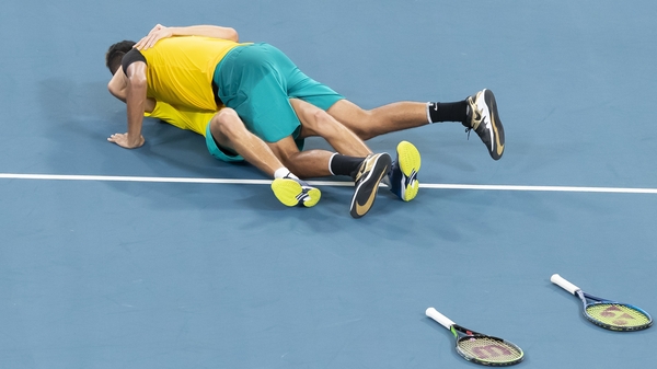Alex de Minaur was overcome by joy - and Nick Kyrgios - after the pair's win over Jamie Murray and Joe Salisbury