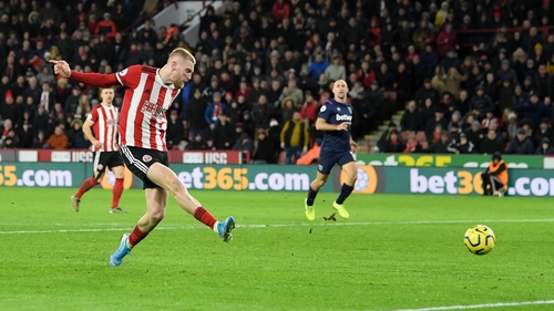 Oliver McBurnie slots the ball home at Bramall Lane