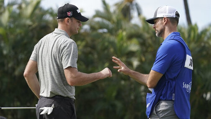 Brendan Steele fist bumps his caddie