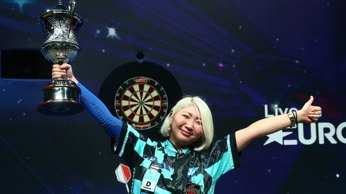 Mikuru Suzuki poses with the trophy