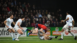 Chris Farrell is tackled by Teddy Iribaren
