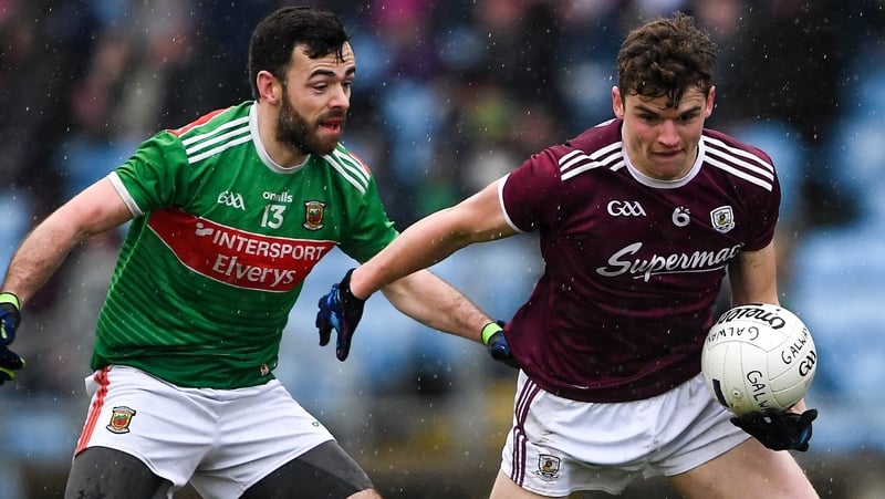 John Daly of Galway (R) holds off Kevin McLoughlin