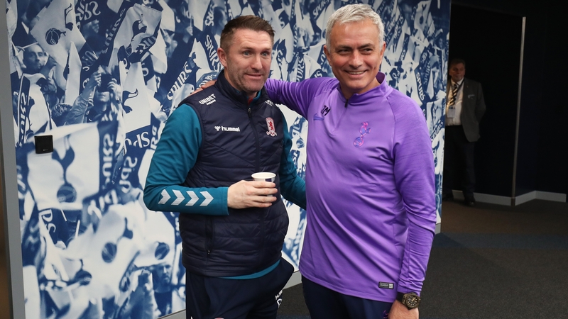 Jose Mourinho, manager of Tottenham Hotspur (R) shakes hands with Robbie Keane, assistant Manager of Middleborough (L) ahead of the FA Cup replay