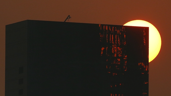 The sun sets during Australian Open qualifying at Melbourne Park