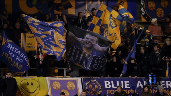 Shrewsbury fans celebrate as they hold the Premier League leaders to a fourth round draw