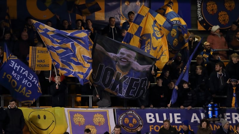 Shrewsbury fans celebrate as they hold the Premier League leaders to a fourth round draw