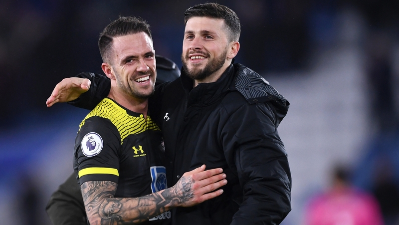 Danny Ings (L) embraces Ireland's Shane Long