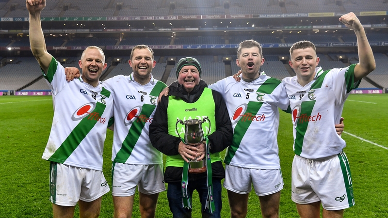Tullaroan mentor Mickey Walsh, centre, with his sons, from left, Tommy, Pádraig, Martin, and Shane