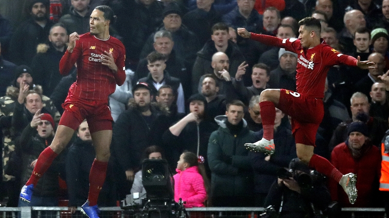 Virgil van Dijk and Roberto Firmino celebrate the opening goal against Mancheser United at Anfield