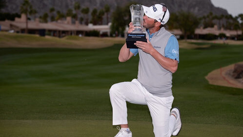 Andrew Landry kisses the trophy