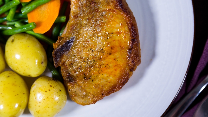 Prepare the pork chops and brush with the flavoured oil, then cover with cling film and store in the fridge on the bottom shelf for up to 2 days.