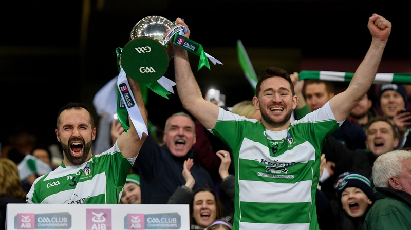 Oughterard's Eddie O'Sullivan (left) and Ronan Molloy lift the cup after their win over Magheracloone
