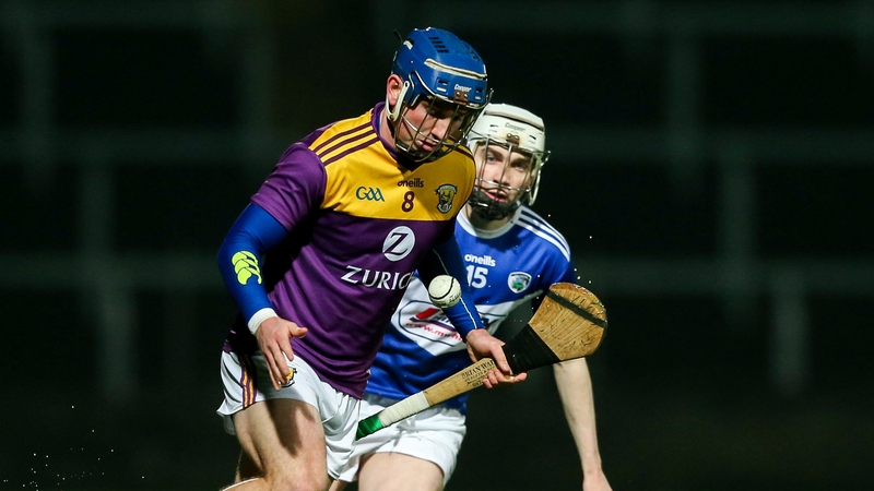 Kevin Foley of Wexford (L) holds off Stephen Bergin
