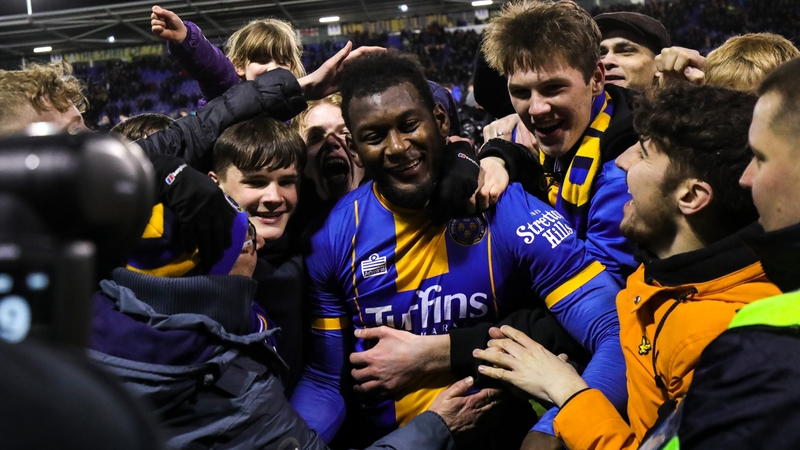 Aaron Pierre is mobbed by Shrewsbury fans after their win against Bristol City