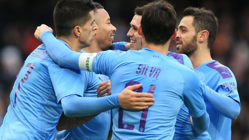 Gabriel Jesus (C) celebrates with teammates after scoring their fourth goal