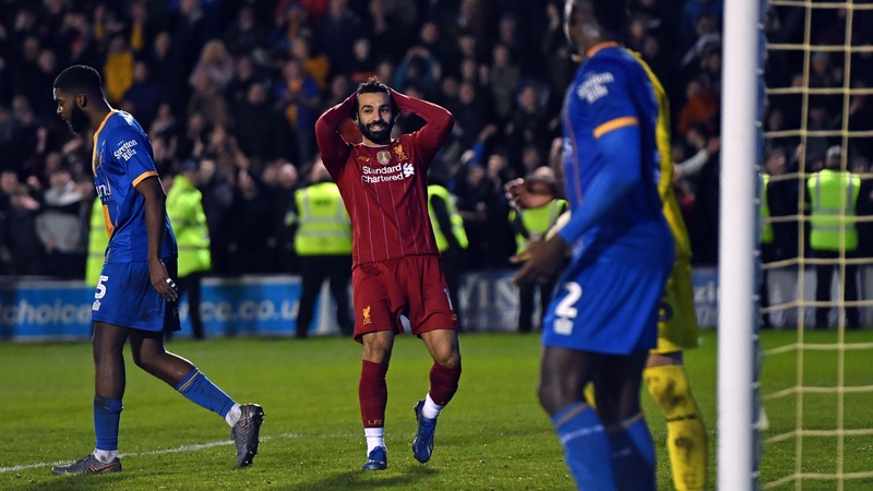 Mohamed Salah (C) reacts to missing a header late in the game