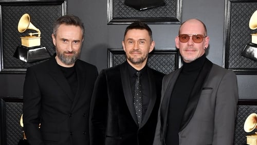 Noel Hogan, Michael Gerard Hogan, and Fergal Lawler of The Cranberries