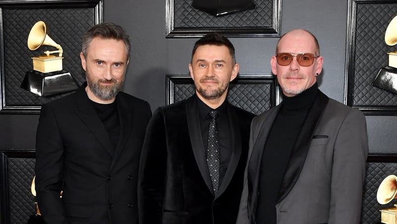 Noel Hogan, Michael Gerard Hogan, and Fergal Lawler of The Cranberries