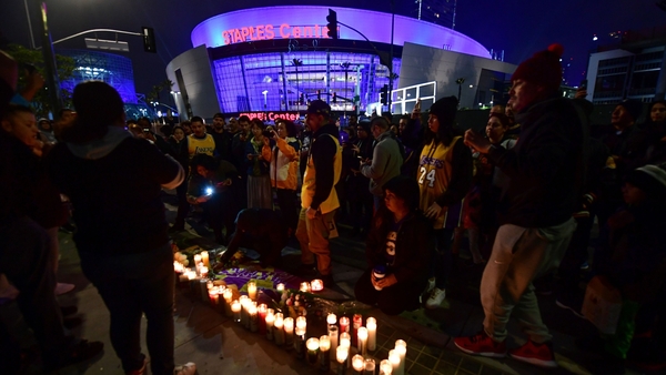 Fans staged a candlelight vigil at the Lakers' home
