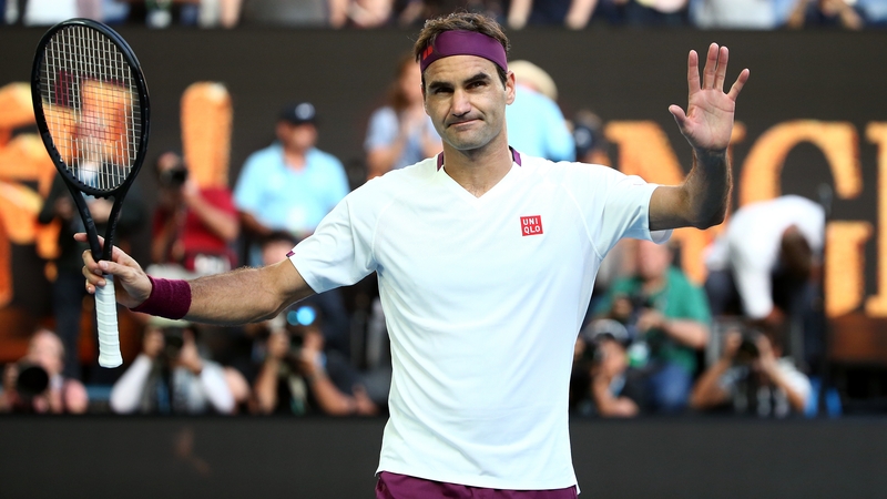Roger Federer celebrates in almost sheepish fashion after falling over the line in Melbourne