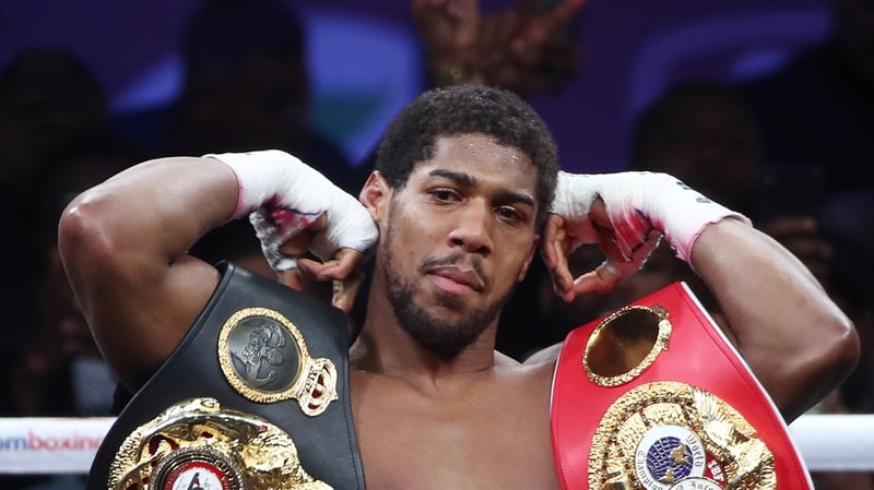 Anthony Joshua holds three heavyweight titles