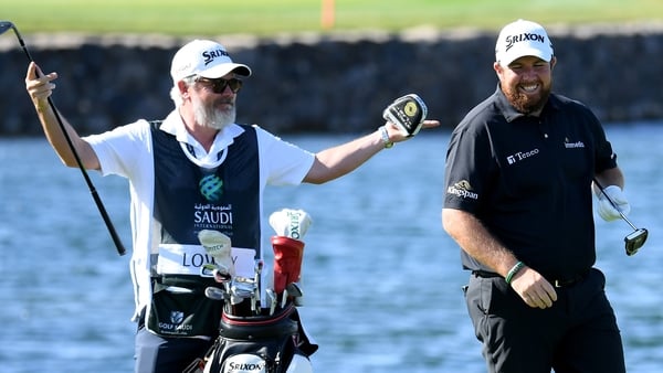 Shane Lowry (R) is in action