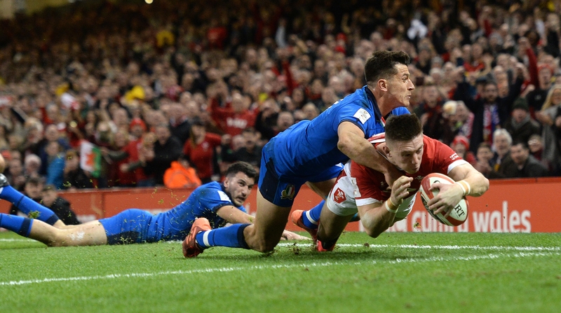 Wales winger Josh Adams dives over for his first try of the game against Italy
