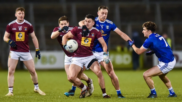 David Lynch of Westmeath in action against Cavan duo Padraig Faulkner and Oisin Kiernan during their Division 2 encounter at Kingspan Breffni Park.