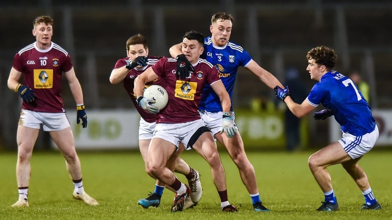David Lynch of Westmeath in action against Cavan duo Padraig Faulkner and Oisin Kiernan during their Division 2 encounter at Kingspan Breffni Park.