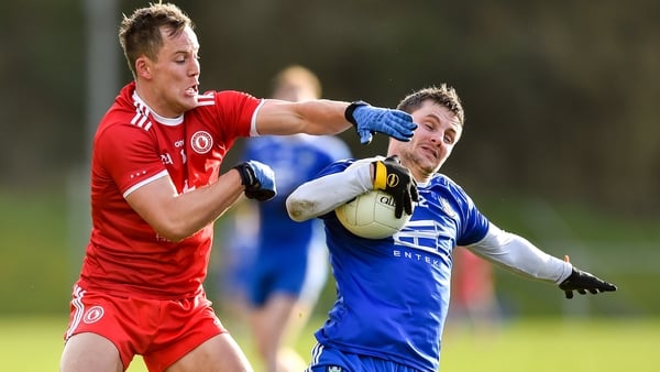 Dermot Malone tries to keep hold of the ball despite the close attention of Tyrone's Kieran McGeary
