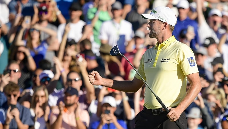 Webb Simpson celebrates his birdie on the first extra hole during the final round of the Phoenix Open