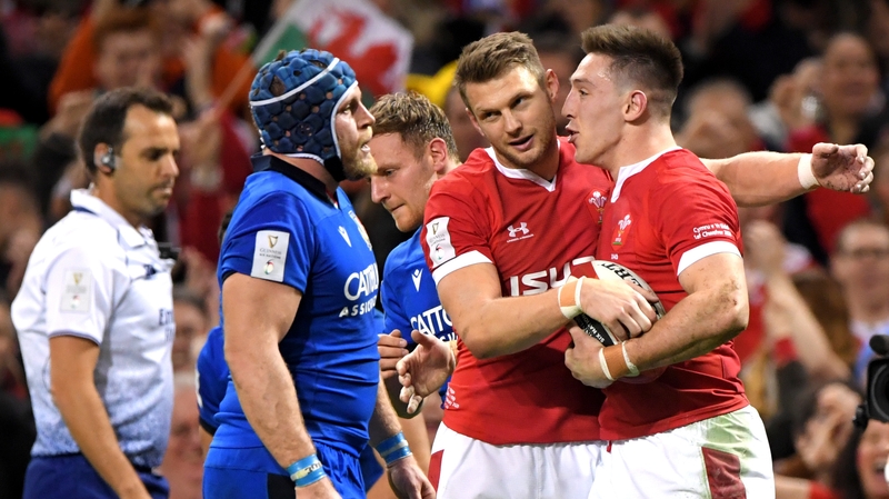 Josh Adams of Wales celebrates with Dan Biggar after scoring his sides second try against Italy