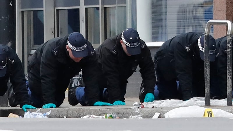 Police conduct a finger-tip search following the terror attack in Streatham High Road