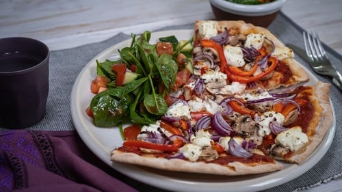 Make the pizza up to 2 days in advance and put it back on to the cardboard from the packet.
