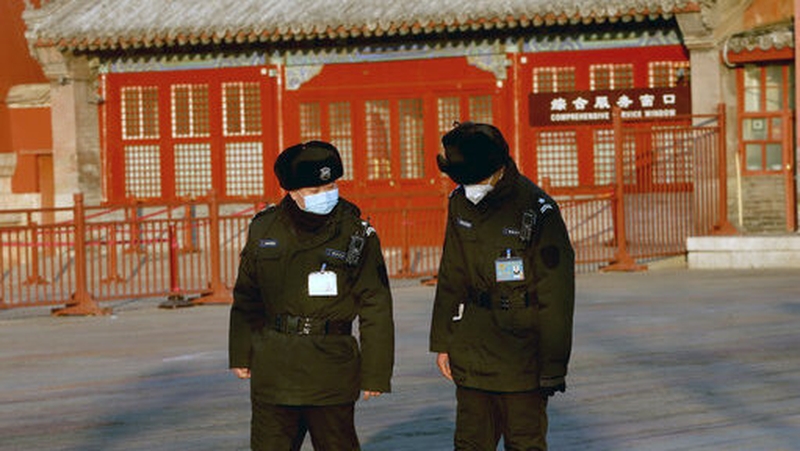 Police patrol the Forbidden City, which remains closed due to the coronavirus alert, in Beijing