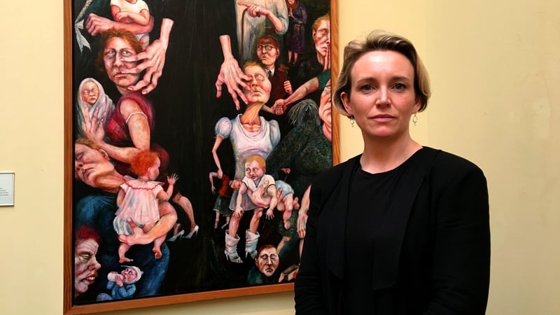 Cristín Leach with Rita Duffy's 1989 painting Segregation