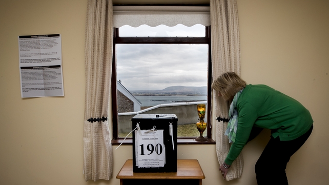 Nancy Sharkey sets up the polling station for the islanders