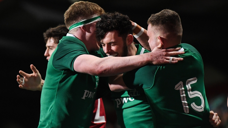 Andrew Smith is congratulated by Sean O'Brien and Oran McNulty after scoring Ireland's fifth try of the night
