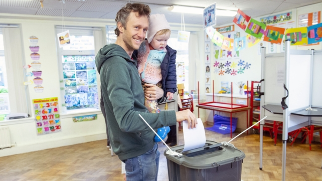 Phil Teare and his daughter Mary Kate casts his ballot at a polling station in Cork